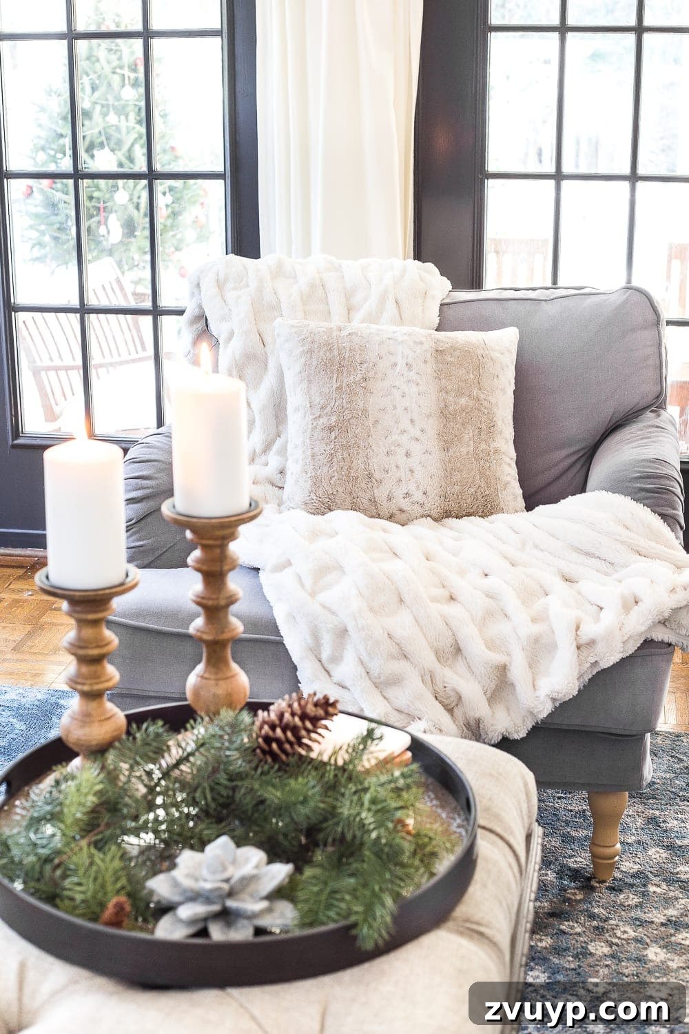 Creating a Cozy Winter Home After Christmas 3 Close-up of a cozy chair adorned with a faux fur throw and cable knit pillow, perfect for winter relaxation.