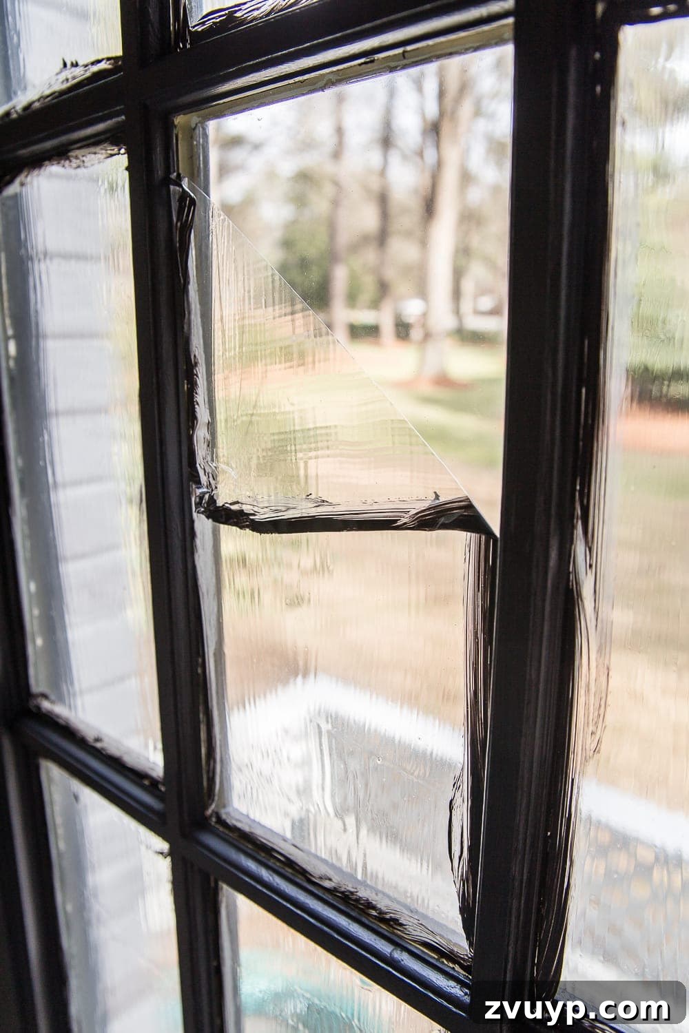 DIY French Door Painting Tips and Replacement Cost Breakdown 15 peeling masking liquid away from a french door window pane