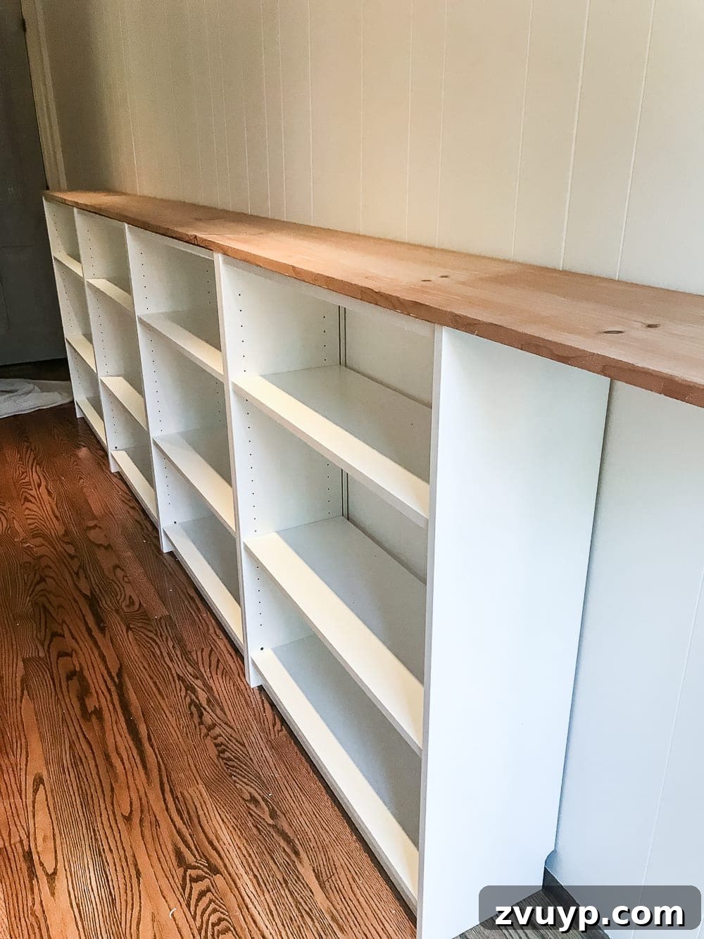 DIY Dream Playroom: Seamless Built-In Bookshelves 11 An easy to follow step-by-step tutorial showing how to build bookcase built-ins using IKEA Billy bookcases. #IKEAhack #homeimprovement #build #playroom