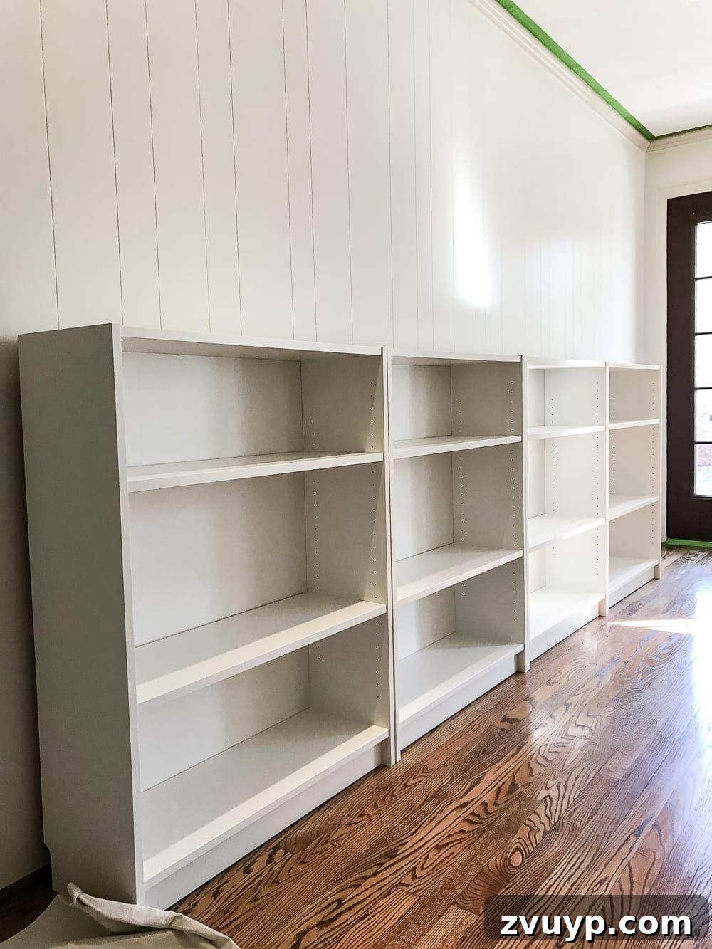 DIY Dream Playroom: Seamless Built-In Bookshelves 4 An easy to follow step-by-step tutorial showing how to build bookcase built-ins using IKEA Billy bookcases. #IKEAhack #homeimprovement #build #playroom