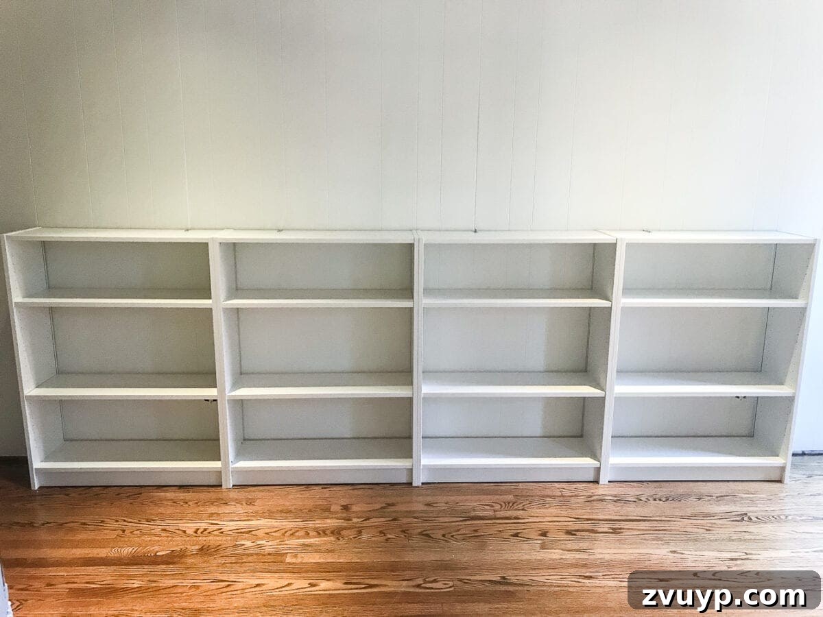 DIY Dream Playroom: Seamless Built-In Bookshelves 9 An easy to follow step-by-step tutorial showing how to build bookcase built-ins using IKEA Billy bookcases. #IKEAhack #homeimprovement #build #playroom