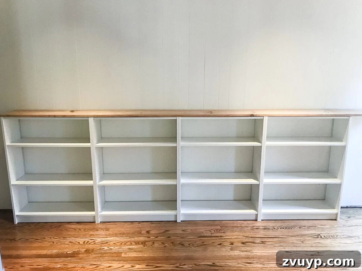 DIY Dream Playroom: Seamless Built-In Bookshelves 10 An easy to follow step-by-step tutorial showing how to build bookcase built-ins using IKEA Billy bookcases. #IKEAhack #homeimprovement #build #playroom