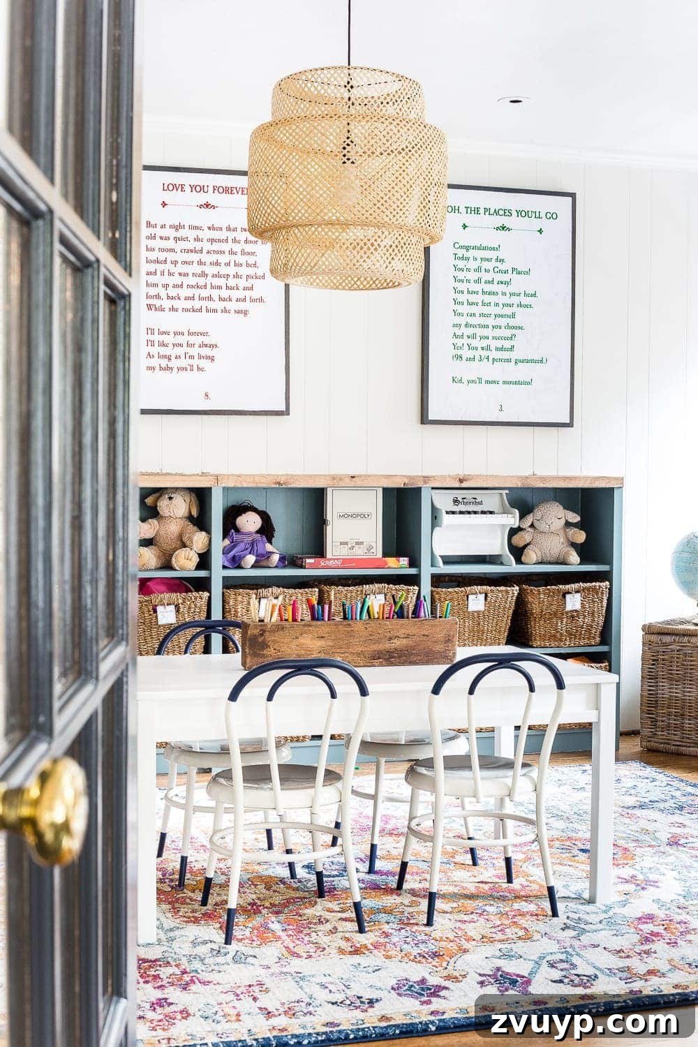 Playroom Glow Up: Fresh Lights and Furnishings 9 DIY storybook art displayed on a playroom wall, adding a personalized and literary touch to the children's decor.