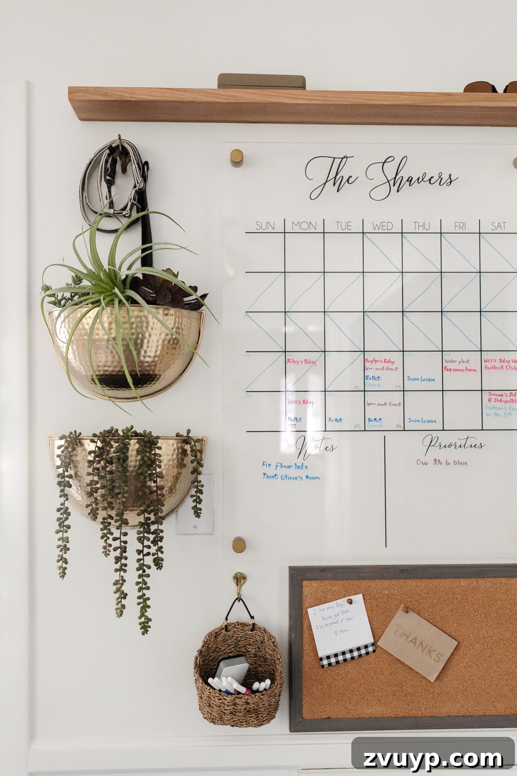 Master Family Chaos Your Command Center Guide 10 family command center with wall calendar, brass planters, shelf, and memo board