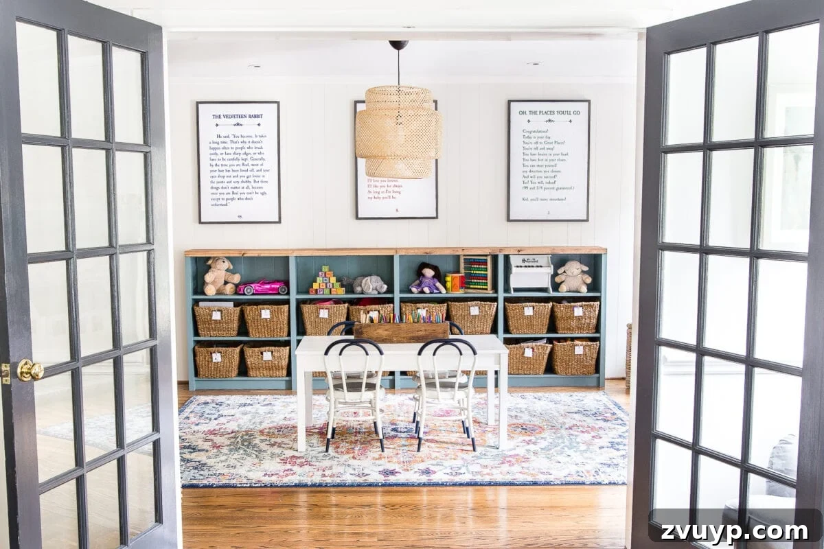Kids Dream Playroom Revealed 3 After playroom makeover showcasing bright colors, organized toys, and a cozy rug, perfect for a whimsical kids' space.