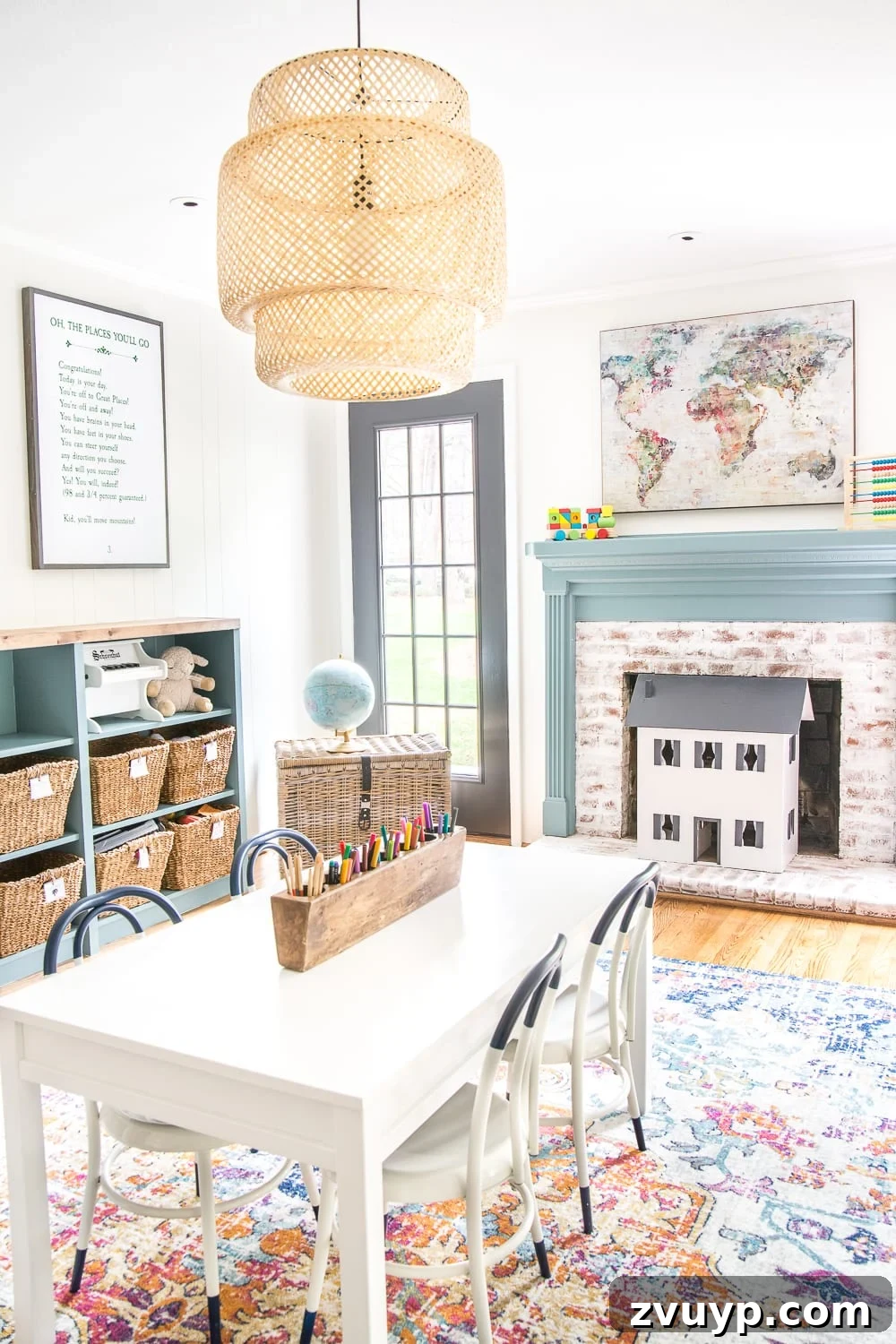 Kids Dream Playroom Revealed 5 Whimsical playroom featuring a cozy corner with a lime washed fireplace and a child's dollhouse, demonstrating budget-friendly kids' decor.