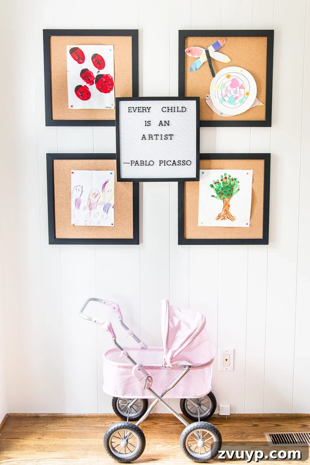 Kids Dream Playroom Revealed 9 Playroom wall art featuring a framed map and playful illustrations, adding a personalized touch to the kids' room.