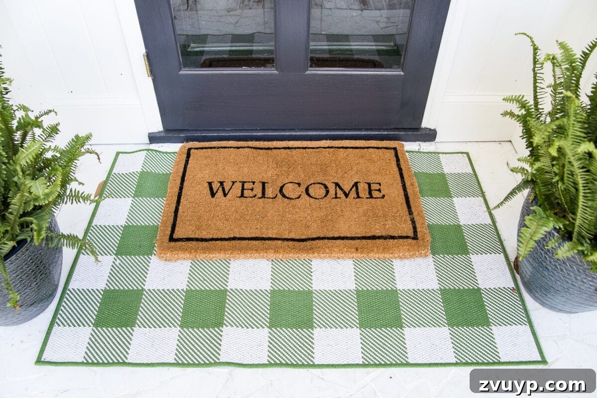 Small Stoop, Big Impact: 4 Easy Decorating Steps 4 4 easy steps to decorate a small porch stoop for spring to make any home more welcoming for guests. #springporch #smallporch #porchstoop