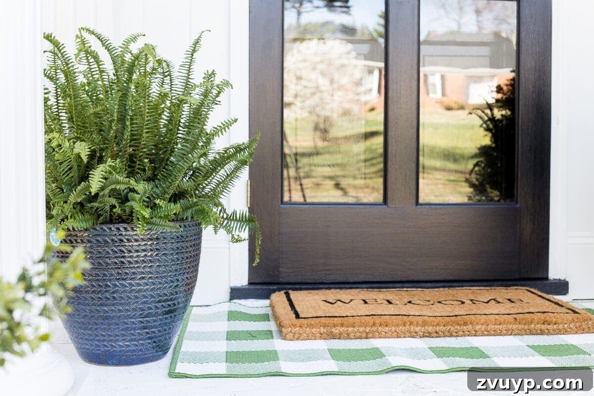 Small Stoop, Big Impact: 4 Easy Decorating Steps 6 4 easy steps to decorate a small porch stoop for spring to make any home more welcoming for guests. #springporch #smallporch #porchstoop