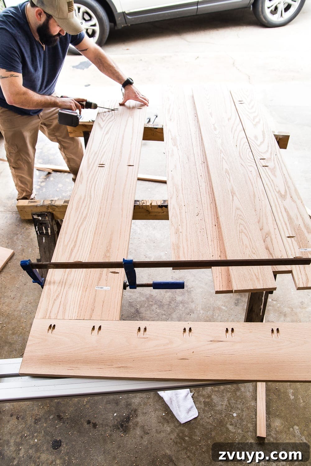 Revamping Your Dining Table Top 12 A tutorial for how to build a retrofitted table top to fit over any existing table using Minwax Dark Walnut stain. #build #furniturebuilding #tabletop #diningtable #diytable #farmhousetable #diyfurniture #woodworking #furnituremakeover #tablemakeover #minwax #woodstain #walnut