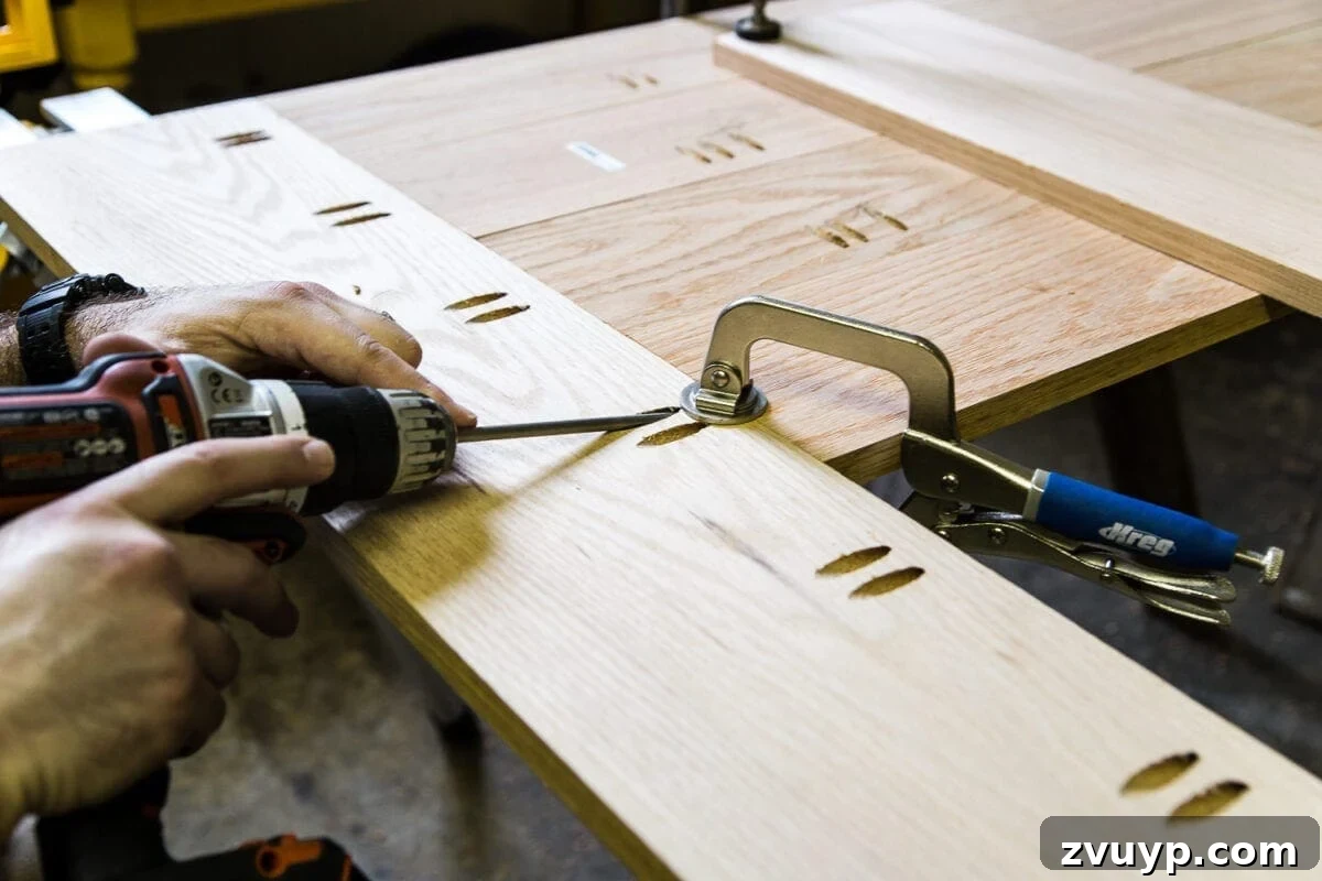 Revamping Your Dining Table Top 13 A tutorial for how to build a retrofitted table top to fit over any existing table using Minwax Dark Walnut stain. #build #furniturebuilding #tabletop #diningtable #diytable #farmhousetable #diyfurniture #woodworking #furnituremakeover #tablemakeover #minwax #woodstain #walnut