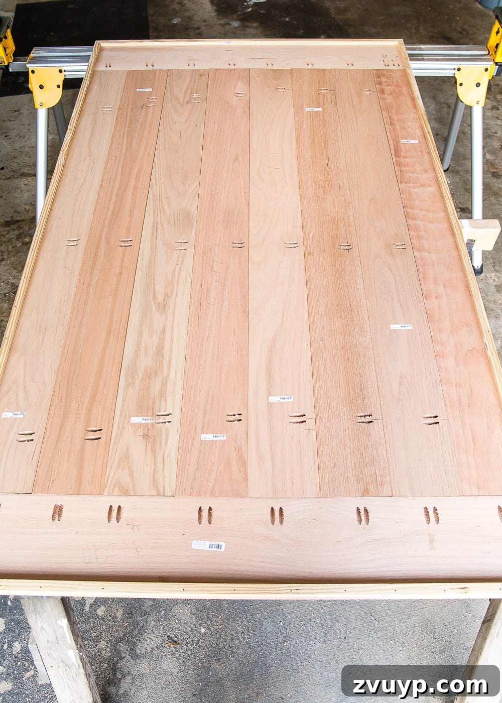 Revamping Your Dining Table Top 14 A tutorial for how to build a retrofitted table top to fit over any existing table using Minwax Dark Walnut stain. #build #furniturebuilding #tabletop #diningtable #diytable #farmhousetable #diyfurniture #woodworking #furnituremakeover #tablemakeover #minwax #woodstain #walnut
