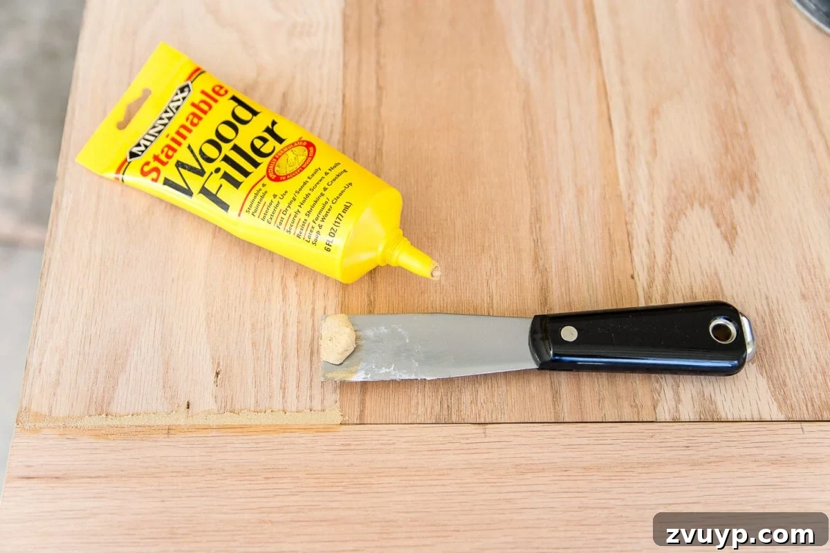 Revamping Your Dining Table Top 16 A tutorial for how to build a retrofitted table top to fit over any existing table using Minwax Dark Walnut stain. #build #furniturebuilding #tabletop #diningtable #diytable #farmhousetable #diyfurniture #woodworking #furnituremakeover #tablemakeover #minwax #woodstain #walnut