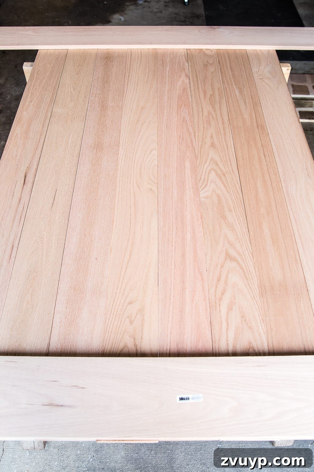 Revamping Your Dining Table Top 6 A tutorial for how to build a retrofitted table top to fit over any existing table using Minwax Dark Walnut stain. #build #furniturebuilding #tabletop #diningtable #diytable #farmhousetable #diyfurniture #woodworking #furnituremakeover #tablemakeover #minwax #woodstain #walnut
