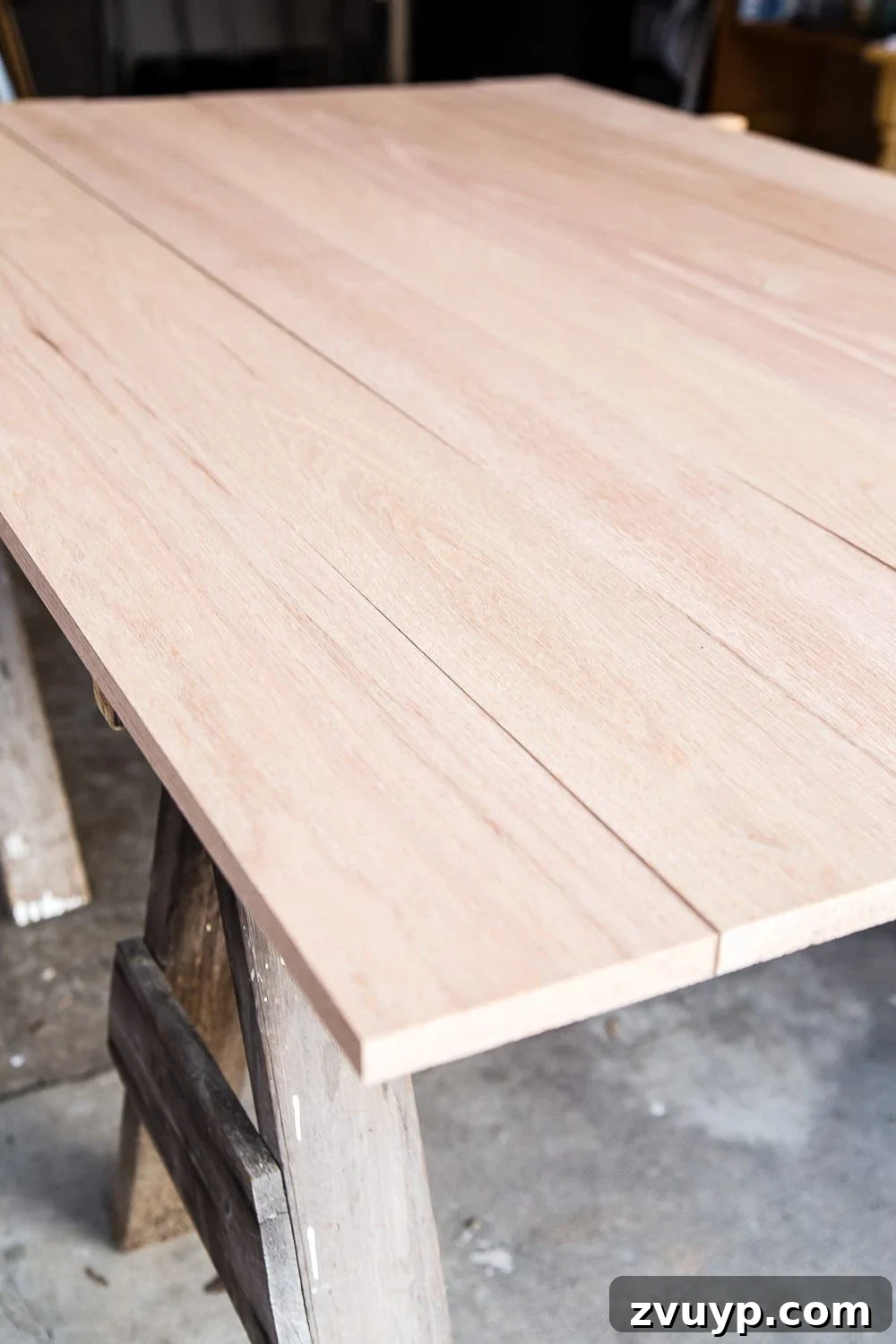 Revamping Your Dining Table Top 8 A tutorial for how to build a retrofitted table top to fit over any existing table using Minwax Dark Walnut stain. #build #furniturebuilding #tabletop #diningtable #diytable #farmhousetable #diyfurniture #woodworking #furnituremakeover #tablemakeover #minwax #woodstain #walnut