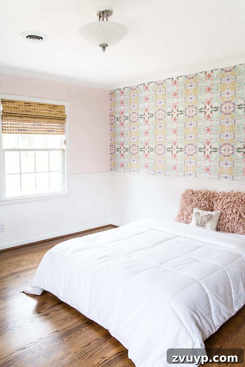 A Magical Makeover: New Wallpaper for Her Bedroom 3 A sweet pastel little girl bedroom makeover with Behr My Sweetheart and retro wallpaper to transition into pre-teen/teenage years. #girlbedroom #kidsdecor #wallpaper #pinkpaint