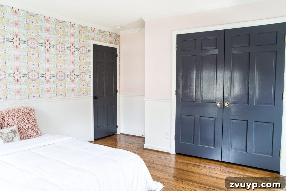 A Magical Makeover: New Wallpaper for Her Bedroom 6 A sweet pastel little girl bedroom makeover with Behr My Sweetheart and retro wallpaper to transition into pre-teen/teenage years. #girlbedroom #kidsdecor #wallpaper #pinkpaint