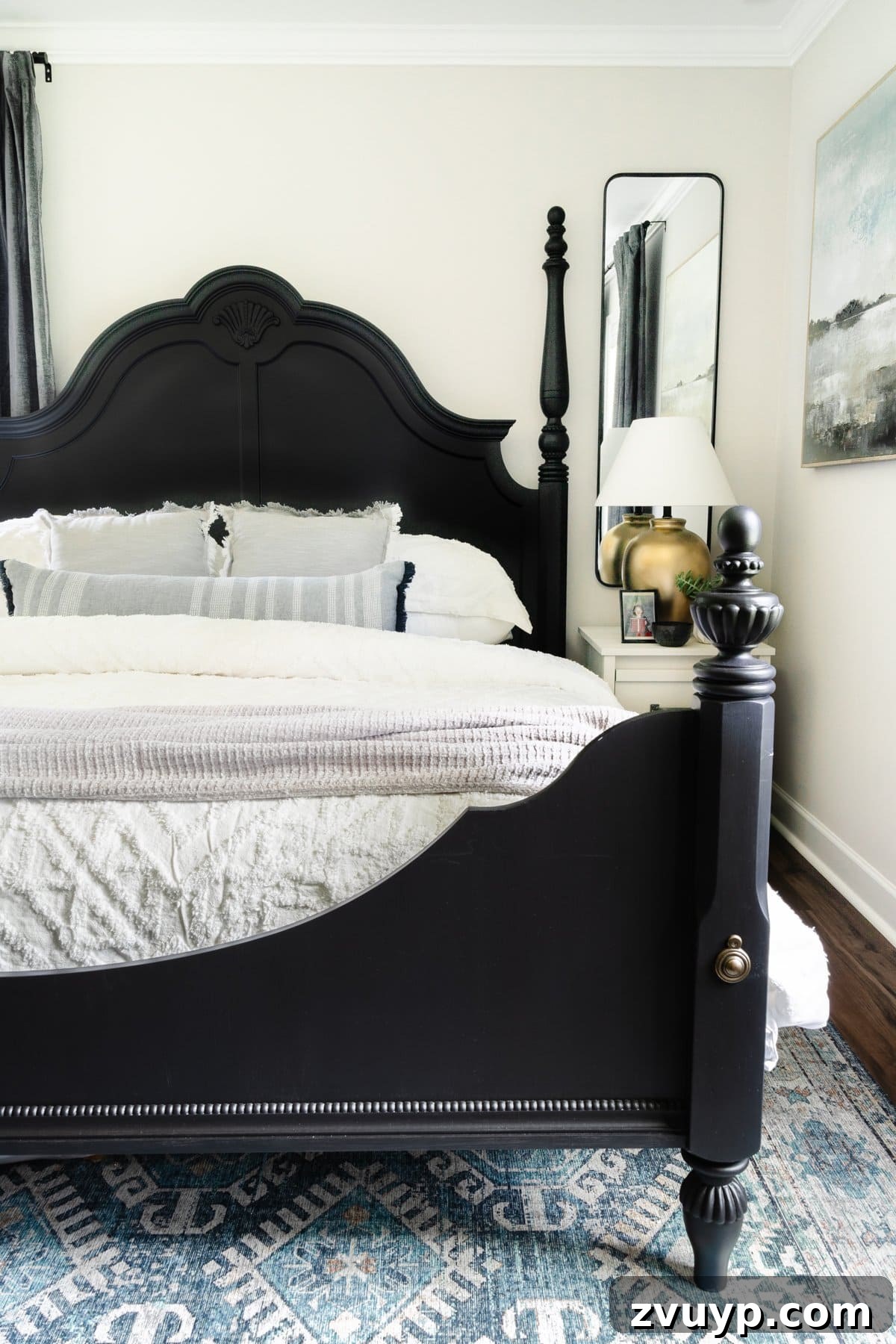 Ageless Interior Design: Lasting Style Principles 15 A classic black poster bed dressed with pristine white bedding, creating a timeless and serene bedroom retreat.