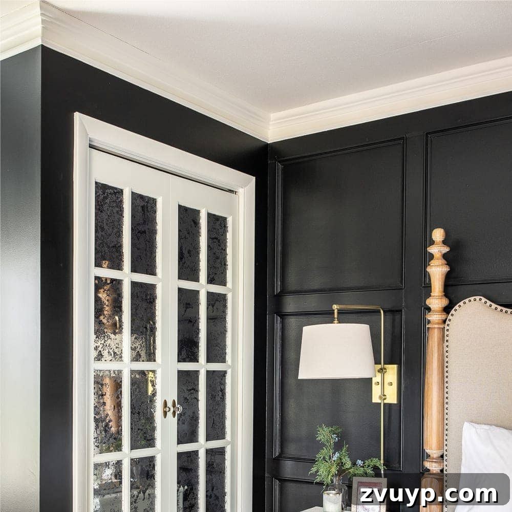 Ageless Interior Design: Lasting Style Principles 9 A striking black bedroom with crisp white doors and elegant crown molding, showcasing a classic and sophisticated design.