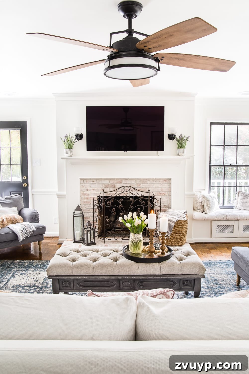 Spring Living Room Refresh 13 A living room gets a spring refresh with simple florals, candle light, and light fabrics. #springdecor #living room #springlivingroom #springaccents #livingroomdesign #livingroomdecor #budgetdecor