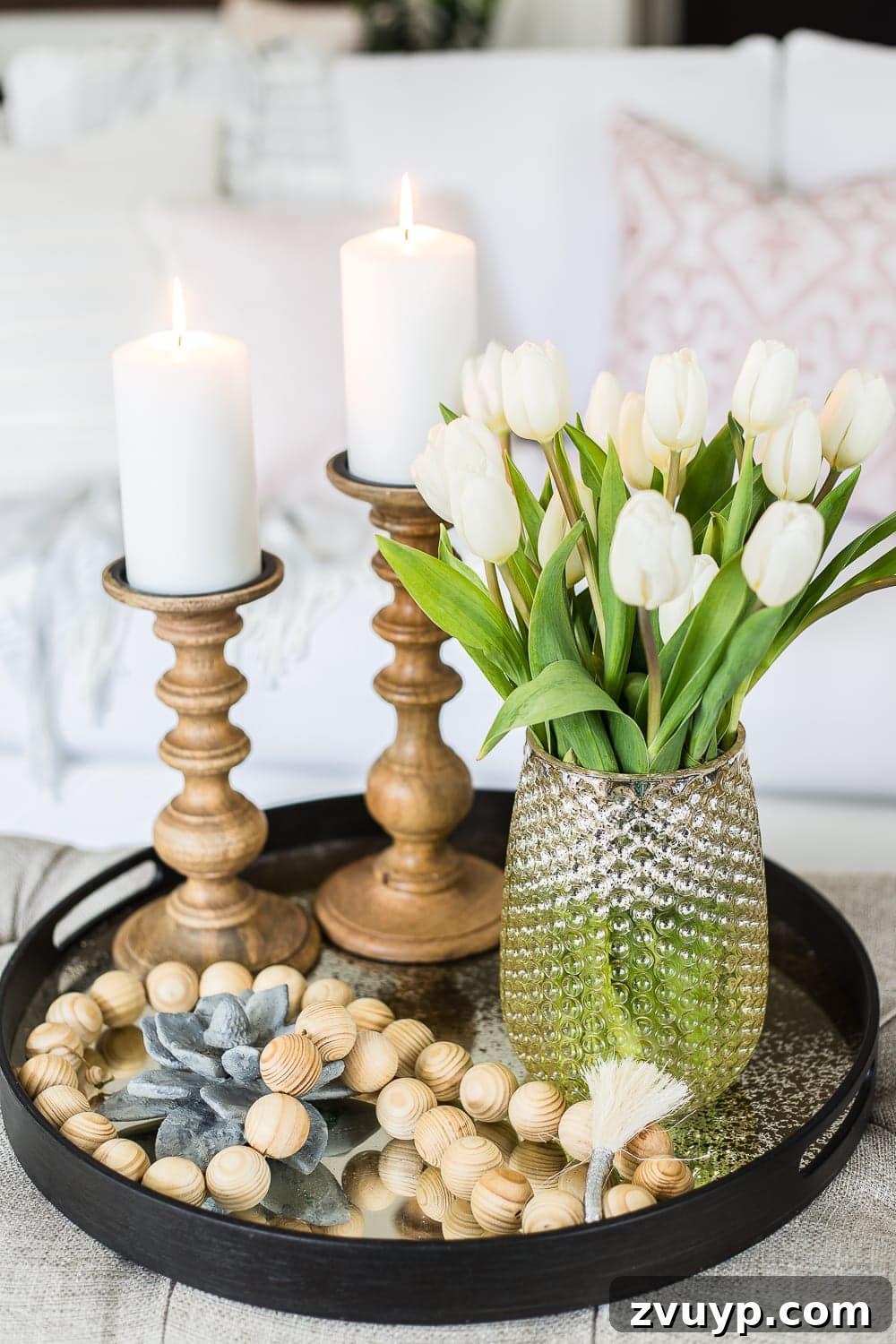 Spring Living Room Refresh 5 A living room gets a spring refresh with simple florals, candle light, and light fabrics. #springdecor #living room #springlivingroom #springaccents #livingroomdesign #livingroomdecor #budgetdecor