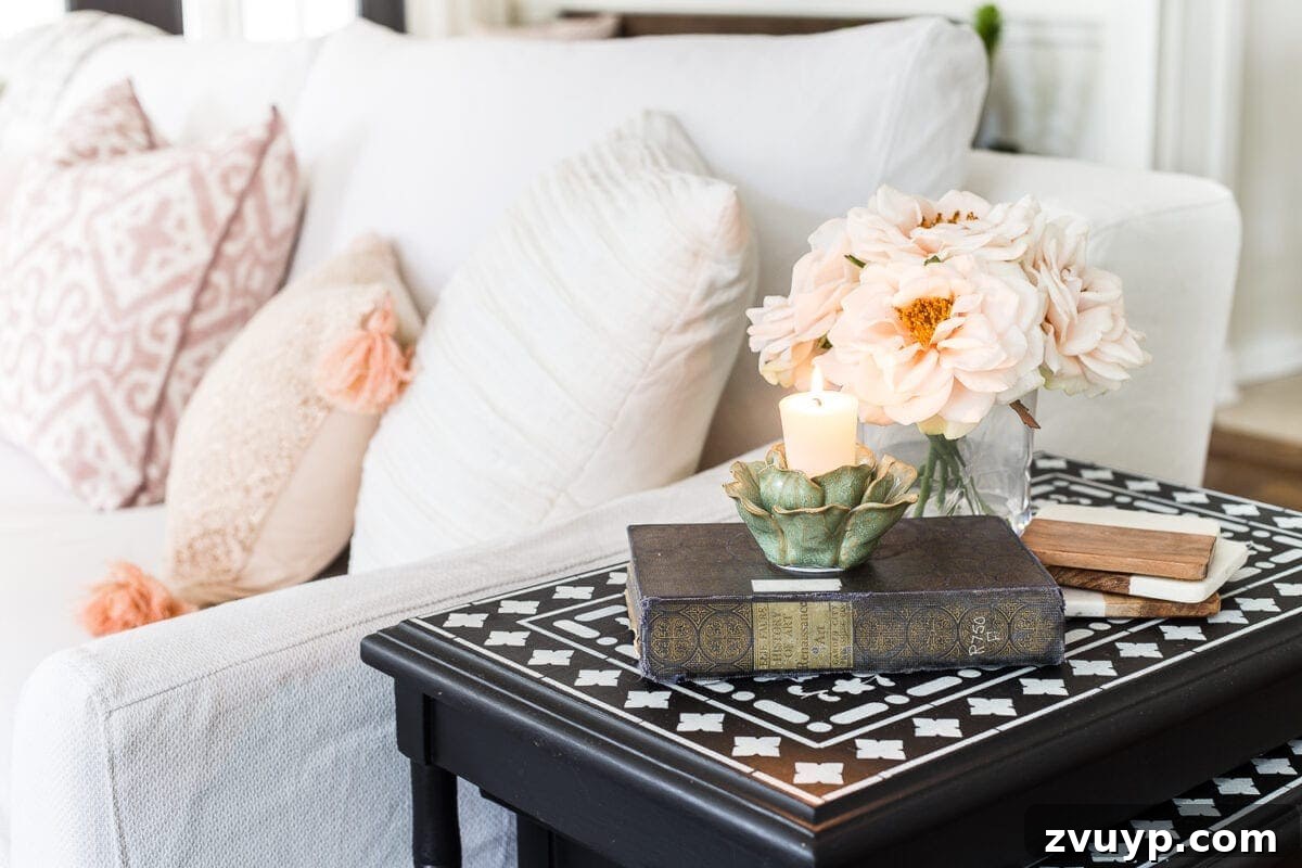 Spring Living Room Refresh 6 A living room gets a spring refresh with simple florals, candle light, and light fabrics. #springdecor #living room #springlivingroom #springaccents #livingroomdesign #livingroomdecor #budgetdecor