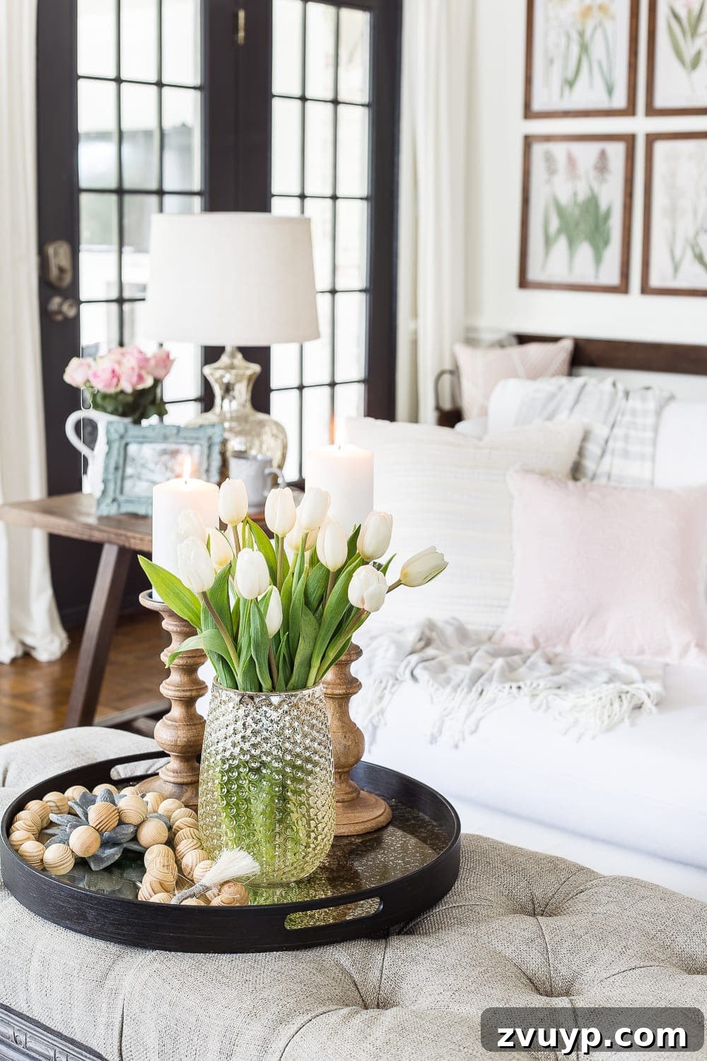 Spring Living Room Refresh 8 A living room gets a spring refresh with simple florals, candle light, and light fabrics. #springdecor #living room #springlivingroom #springaccents #livingroomdesign #livingroomdecor #budgetdecor