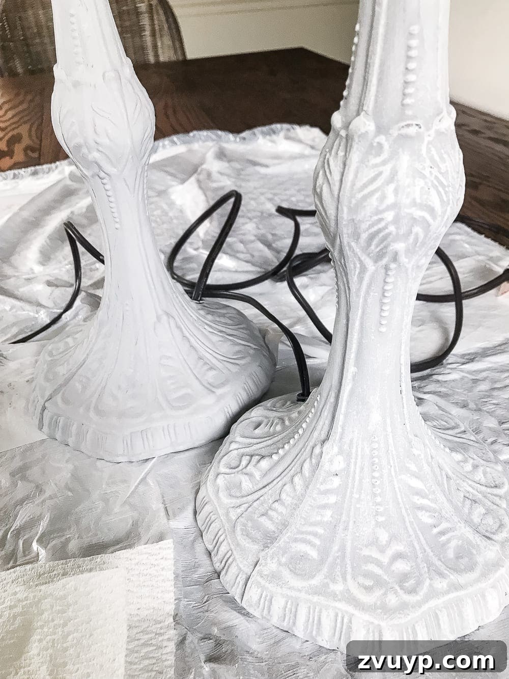 A thrifted table lamp gets a French Baroque designer inspired makeover using Annie Sloan Chalk Paint in Paris Grey, Pure White, clear wax, and dark wax. #thriftdecor #thrifted #thrifting #thriftmakeover #lamp #bedroom #girlbedroom #littlegirlbedroom #frenchdecor #femininedecor #designerknockoff #designerdecor 