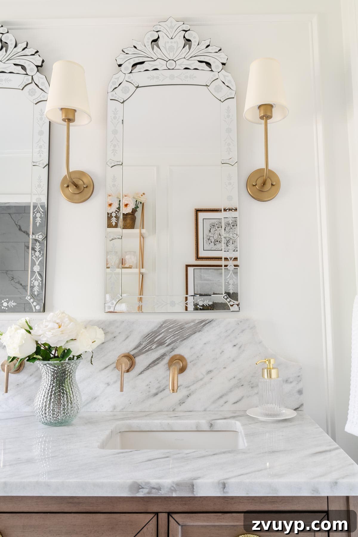 Vintage Wall Sconces: Timeless Designs for Every Budget & Every Space 11 shaded vintage wall sconces on either side of a Venetian mirror in a bathroom with marble countertop