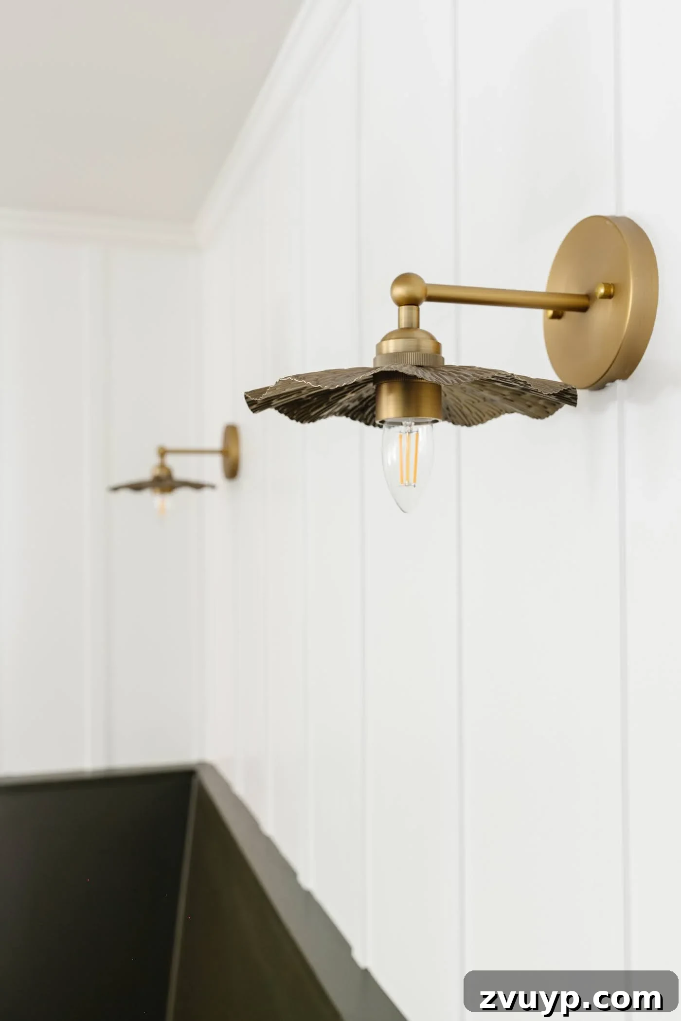 Vintage Wall Sconces: Timeless Designs for Every Budget & Every Space 3 flower vintage wall sconces on a white board and batten wall