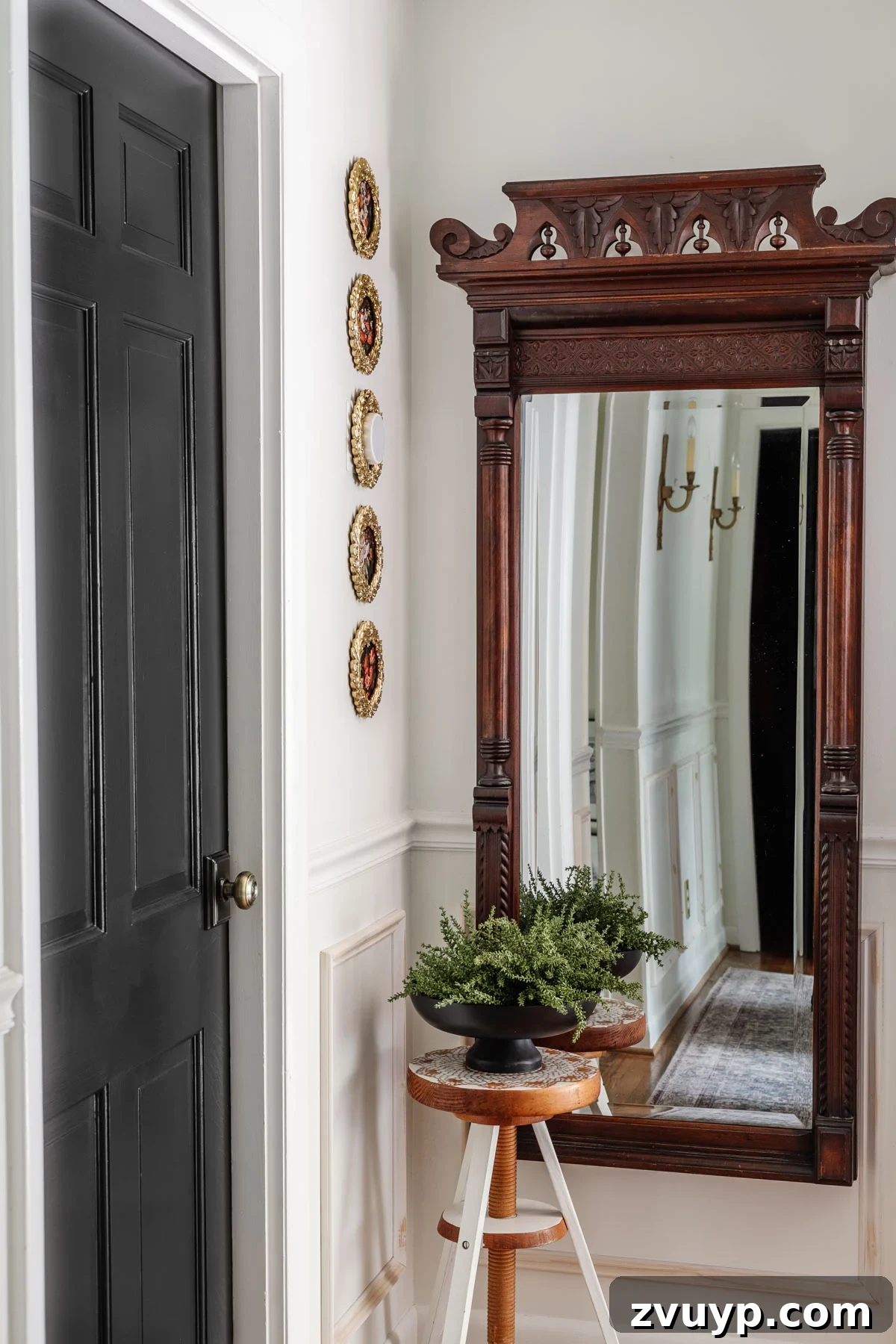 Mastering Thermostat Disguise Without Impacting Its Efficiency 6 Beautifully curated mini gallery wall in a hallway, featuring a central ornate gold framed thermostat surrounded by four smaller frames displaying vintage floral art prints.