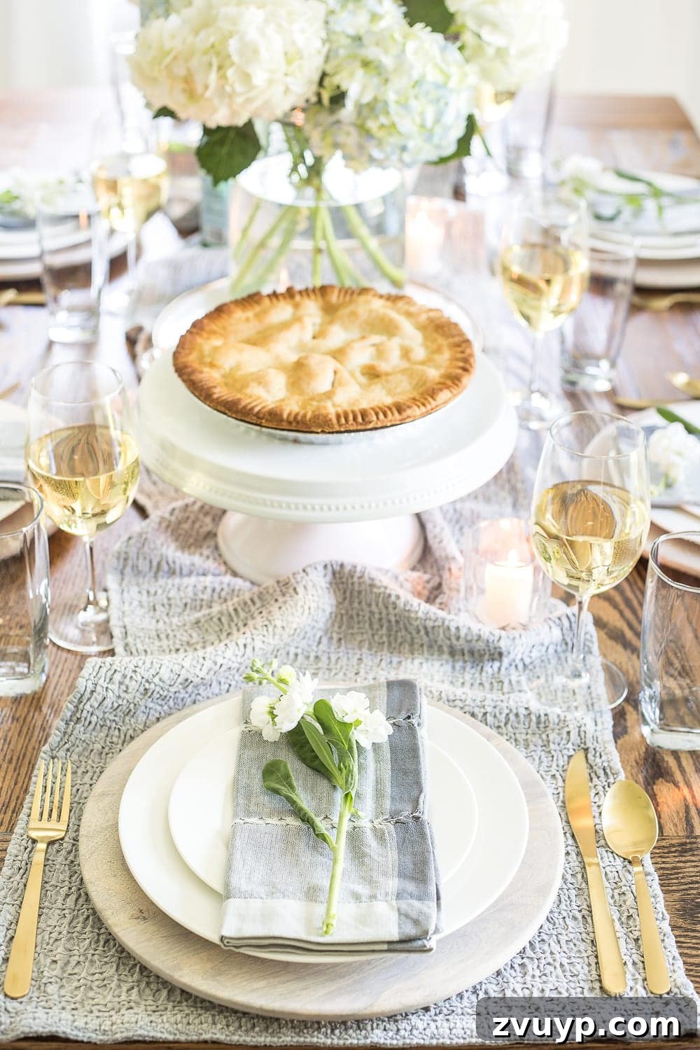 Inspiring Summer Homes 2018 13 Detailed view of a summer tablescape featuring fresh berries, a decorative serving dish, and classic silverware, perfect for a family feast. #summertabledecor #berries #silverware #familyfeast #hometourinspiration #diningroomdecor