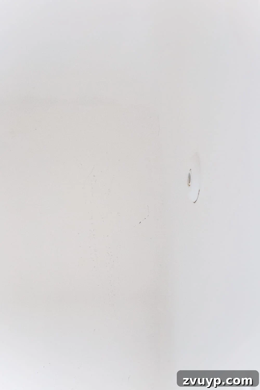 Our Painted Bathroom Sink, Counter, Tub, Shower An 8-Month Durability Update 14 Close-up of minor scratches in the bottom of the refinished tub, acknowledging the only reported damage after 8 months of heavy use.
