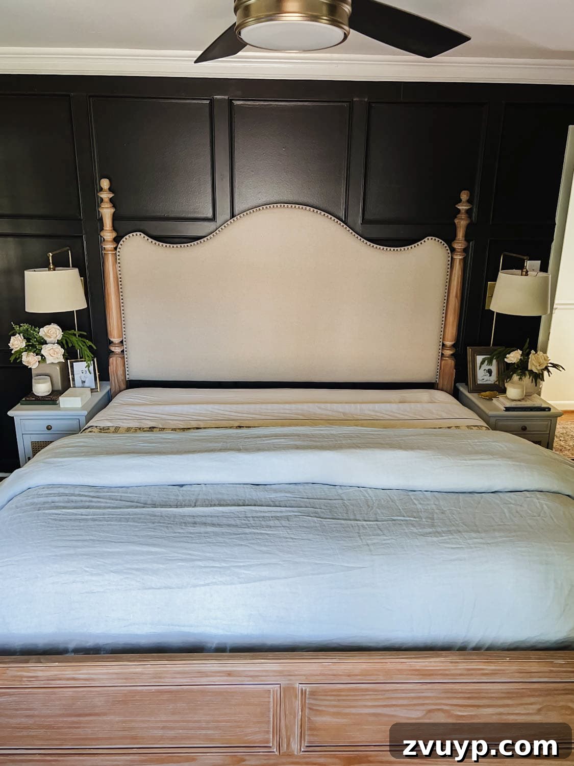 Master the Magazine Worthy Bed 11 A fluffy white duvet folded twice at the foot of the bed, creating a plush, inviting look.