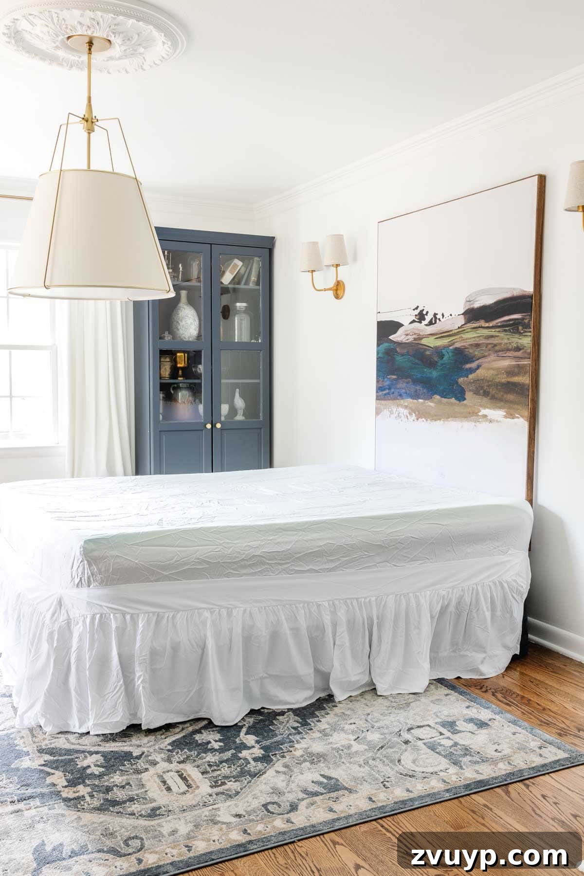 Master the Magazine Worthy Bed 4 A guest room bed with a neatly fitted bed skirt, creating the illusion of a traditional bed even with an air mattress.