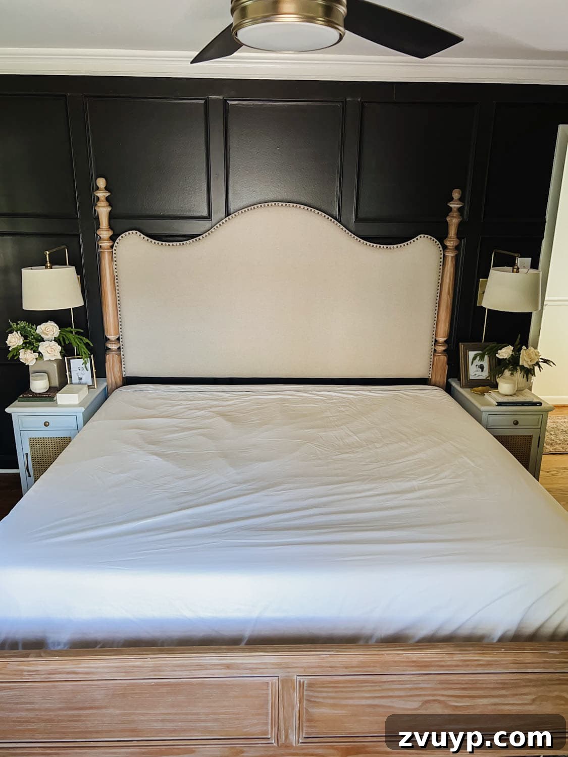Master the Magazine Worthy Bed 7 A neatly made bed with white sateen sheets, showcasing the smoothness and quality of the bedding.