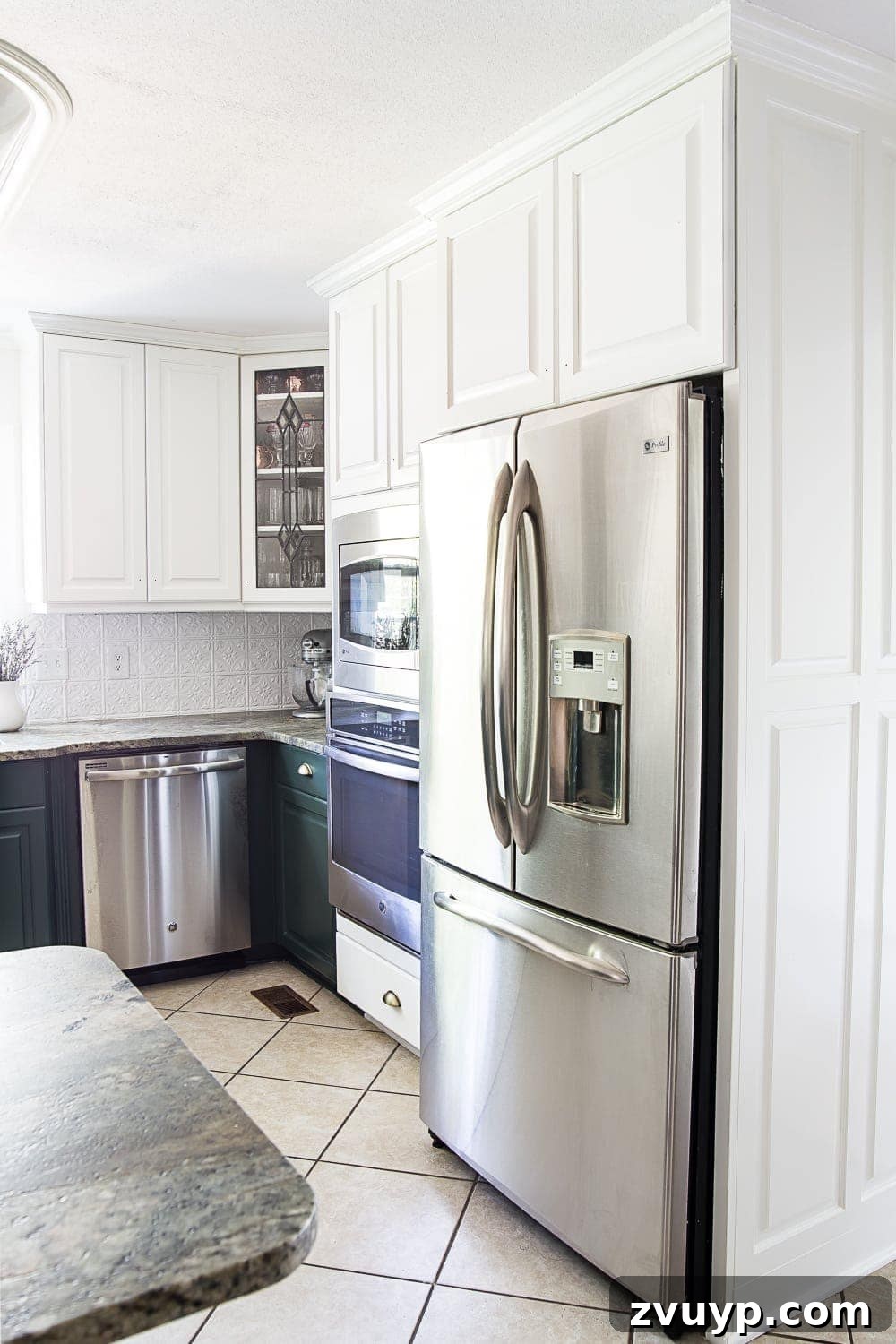 Vibrant Green Kitchen Cabinet Makeover 5 White upper cabinets and Sherwin Williams Billiard Green lower cabinets around kitchen oven and refrigerator for a high contrast look