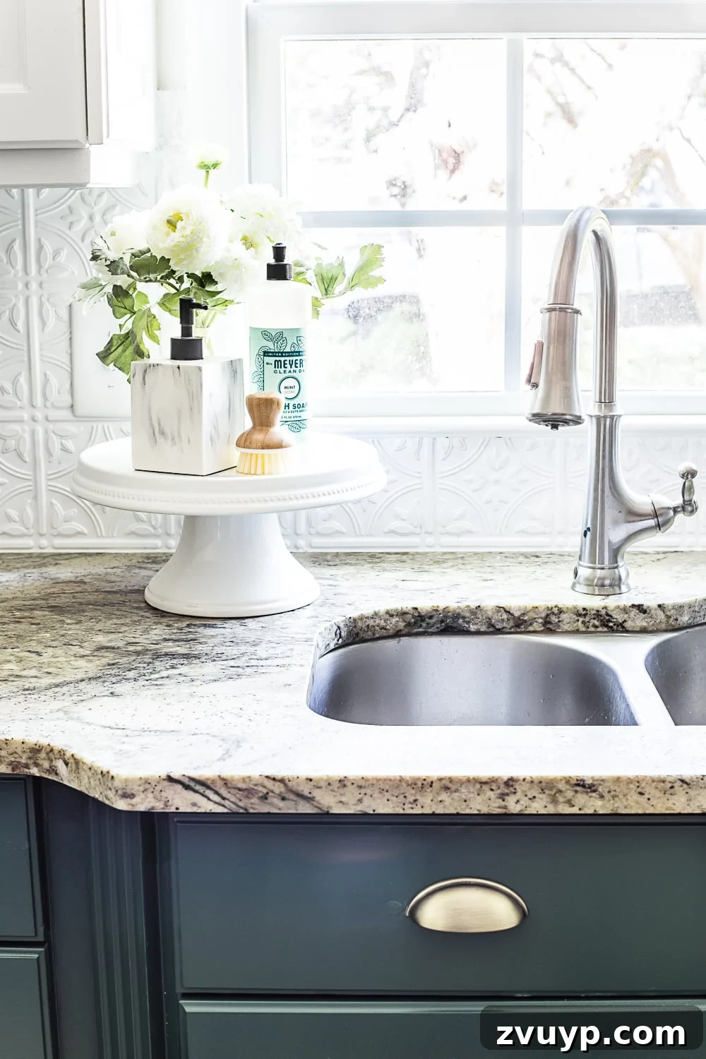 Vibrant Green Kitchen Cabinet Makeover 7 Close up view of leathered granite countertops showcasing their unique texture and subtle green tint