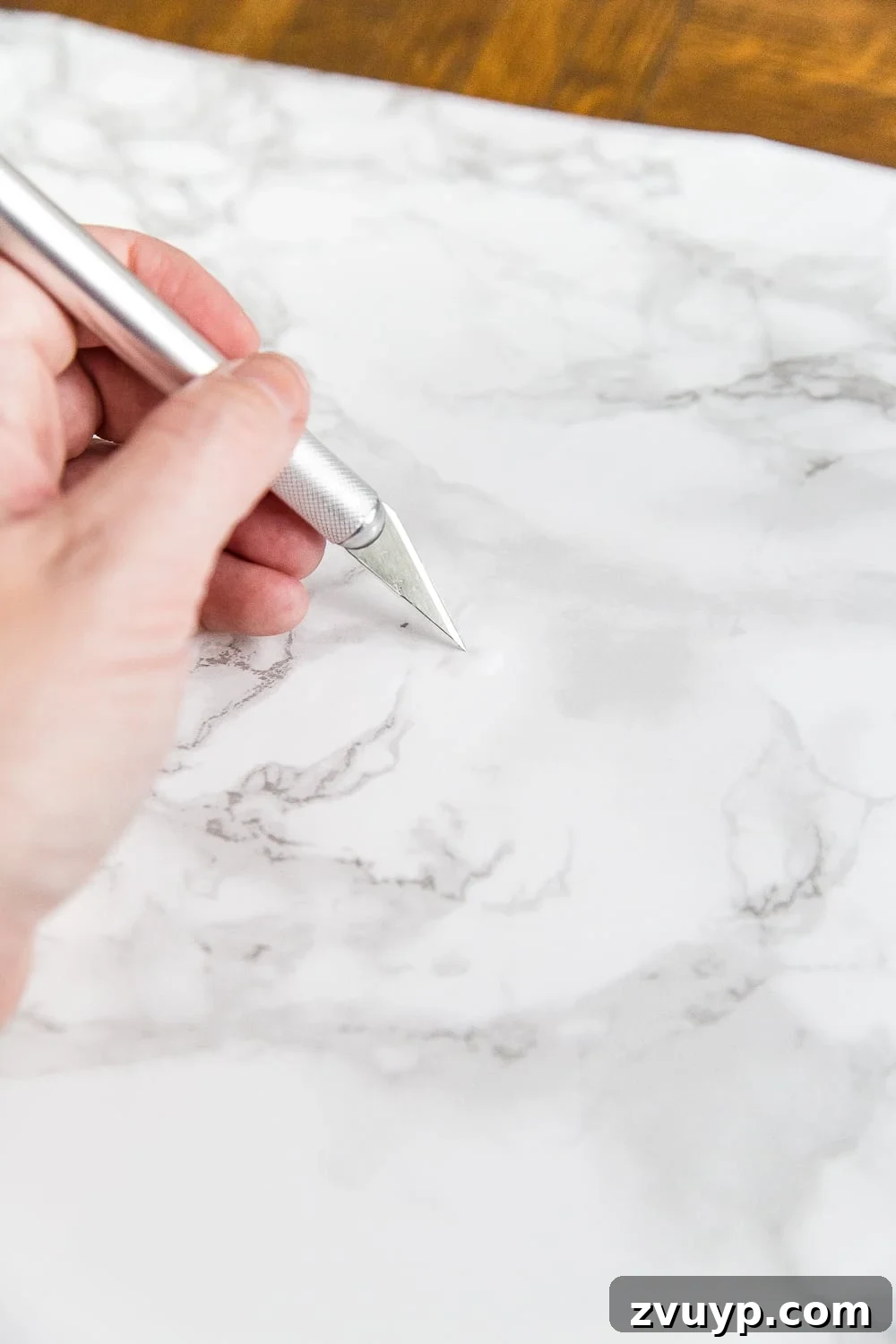 Chic Marble-Effect Coffee Table 8 Tip for removing air bubbles from contact paper using an X-acto knife