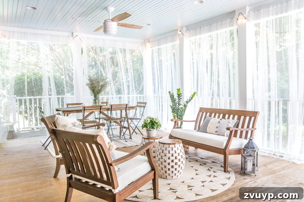 Our Summer Porch Haven 17 Summer back porch with mosquito net curtains creating a screened effect