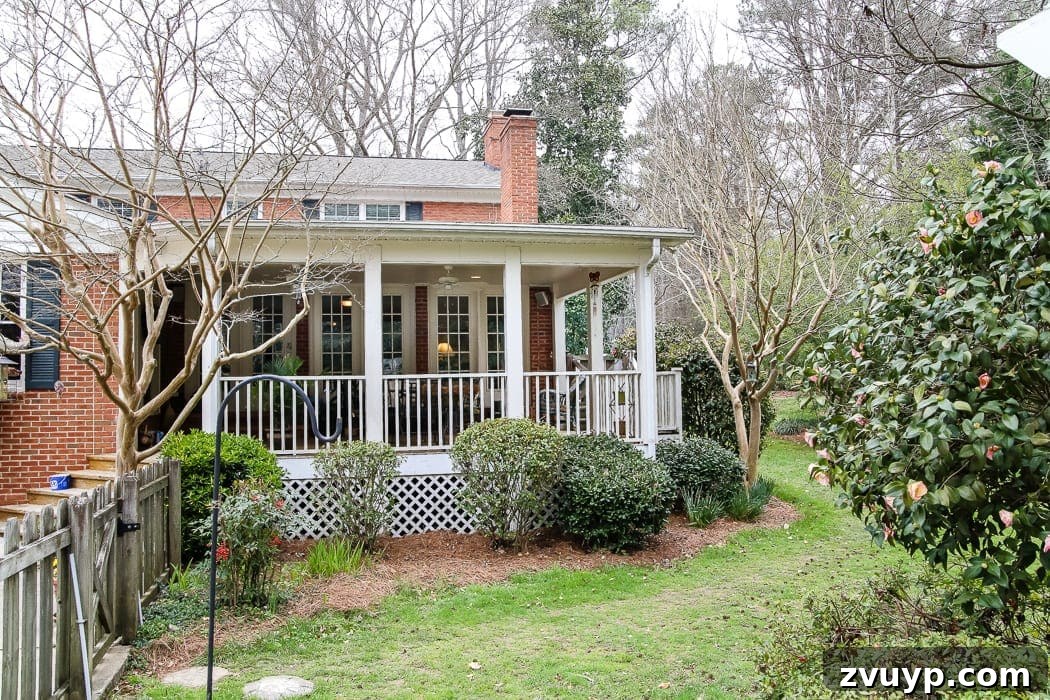 Our Summer Porch Haven 23 Before shot of the backyard exterior with the original brick and porch