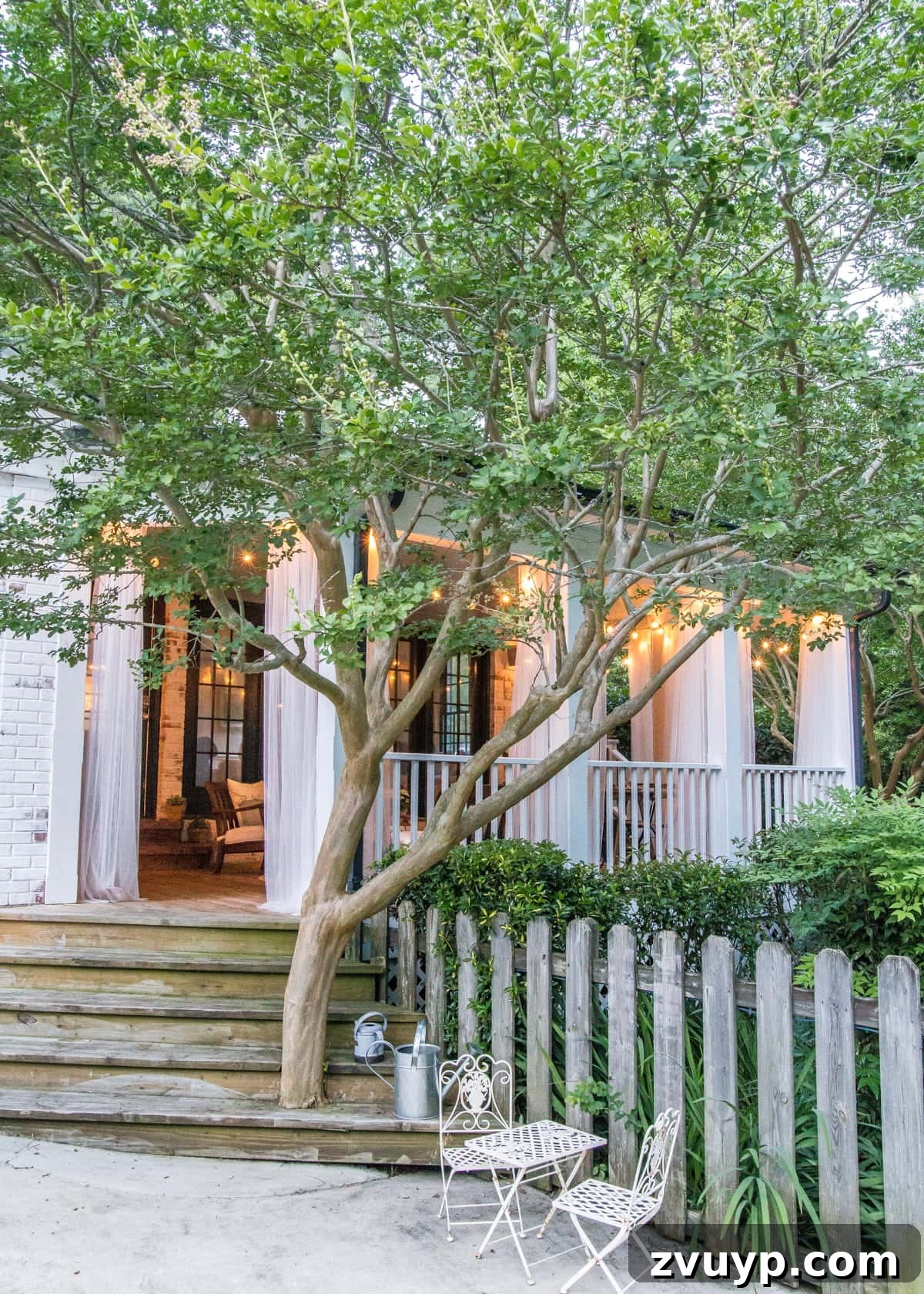 Our Summer Porch Haven 25 Transformed back porch with string lights in the backyard, showcasing the finished space