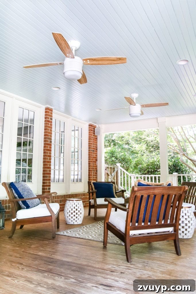 Our Summer Porch Haven 4 Back porch with a newly painted haint blue ceiling and updated ceiling fans