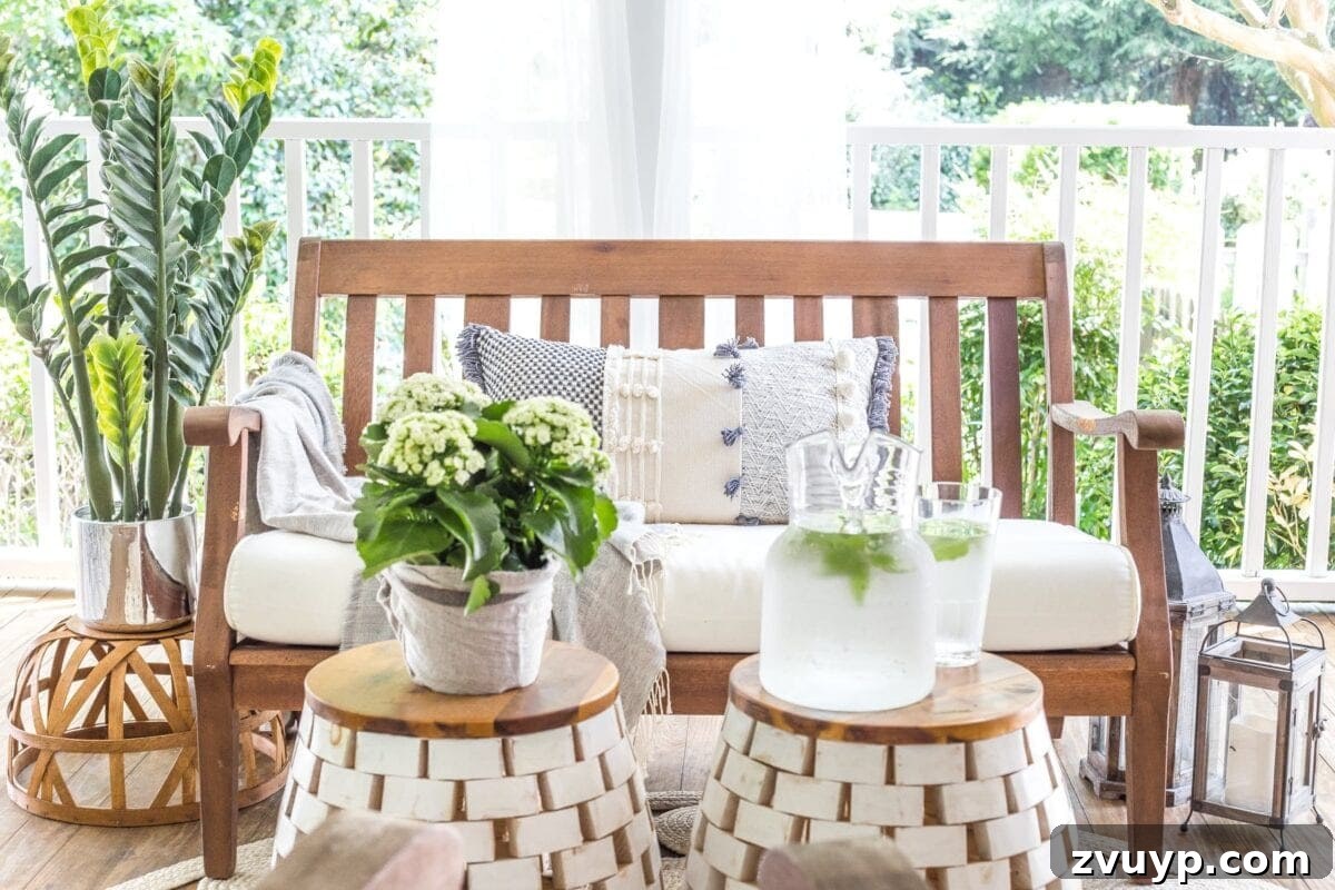 Our Summer Porch Haven 10 Back porch summer decorating with garden stools and a potted plant