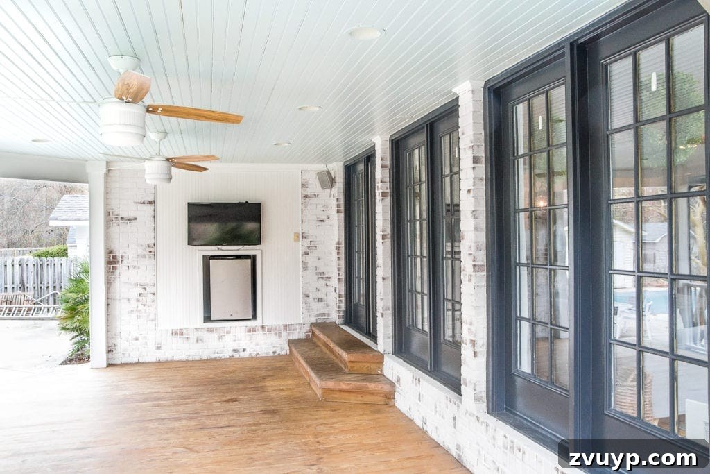 Under $100 Porch Transformation: DIY Screens and Privacy Curtains 2 limewashed brick back porch with haint blue ceiling