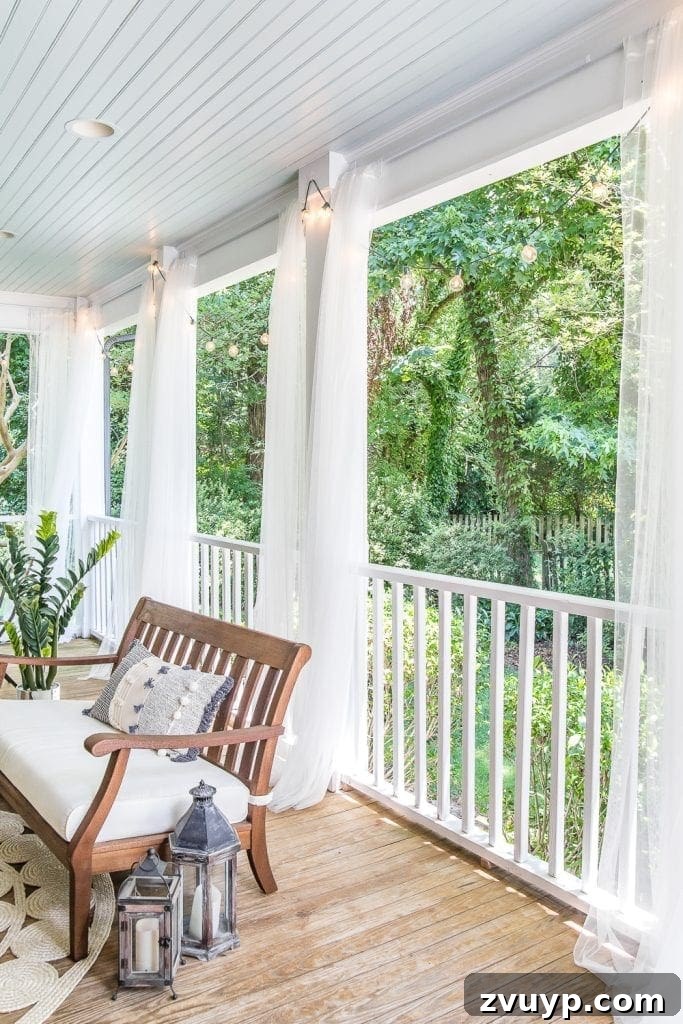 Under $100 Porch Transformation: DIY Screens and Privacy Curtains 5 back porch outdoor curtains with haint blue ceiling