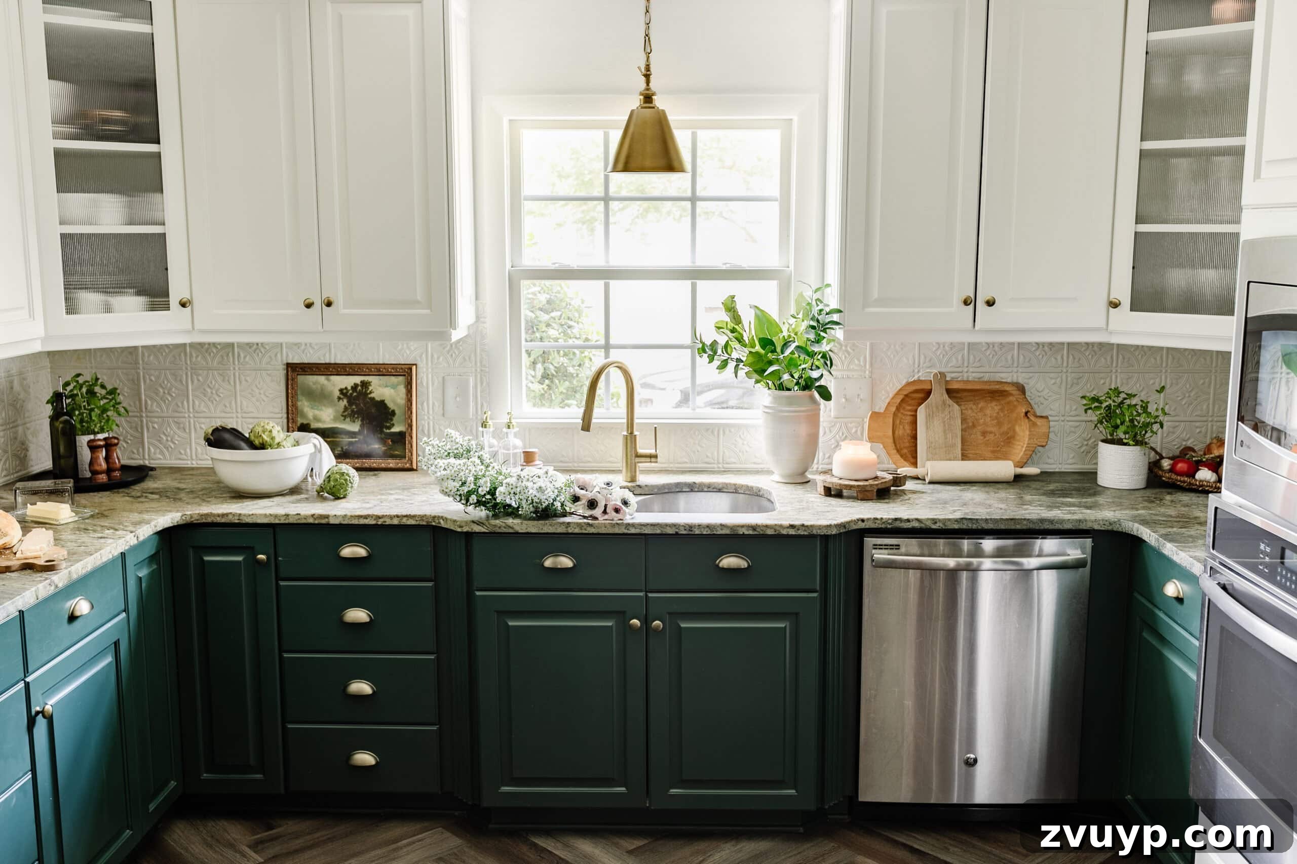 Cozy Cottagecore Kitchen Transformations That Won't Break the Bank 21 A charming cottagecore kitchen showcasing green lower cabinets and white upper cabinets, with the sink beautifully positioned in front of a window, bathed in natural light.