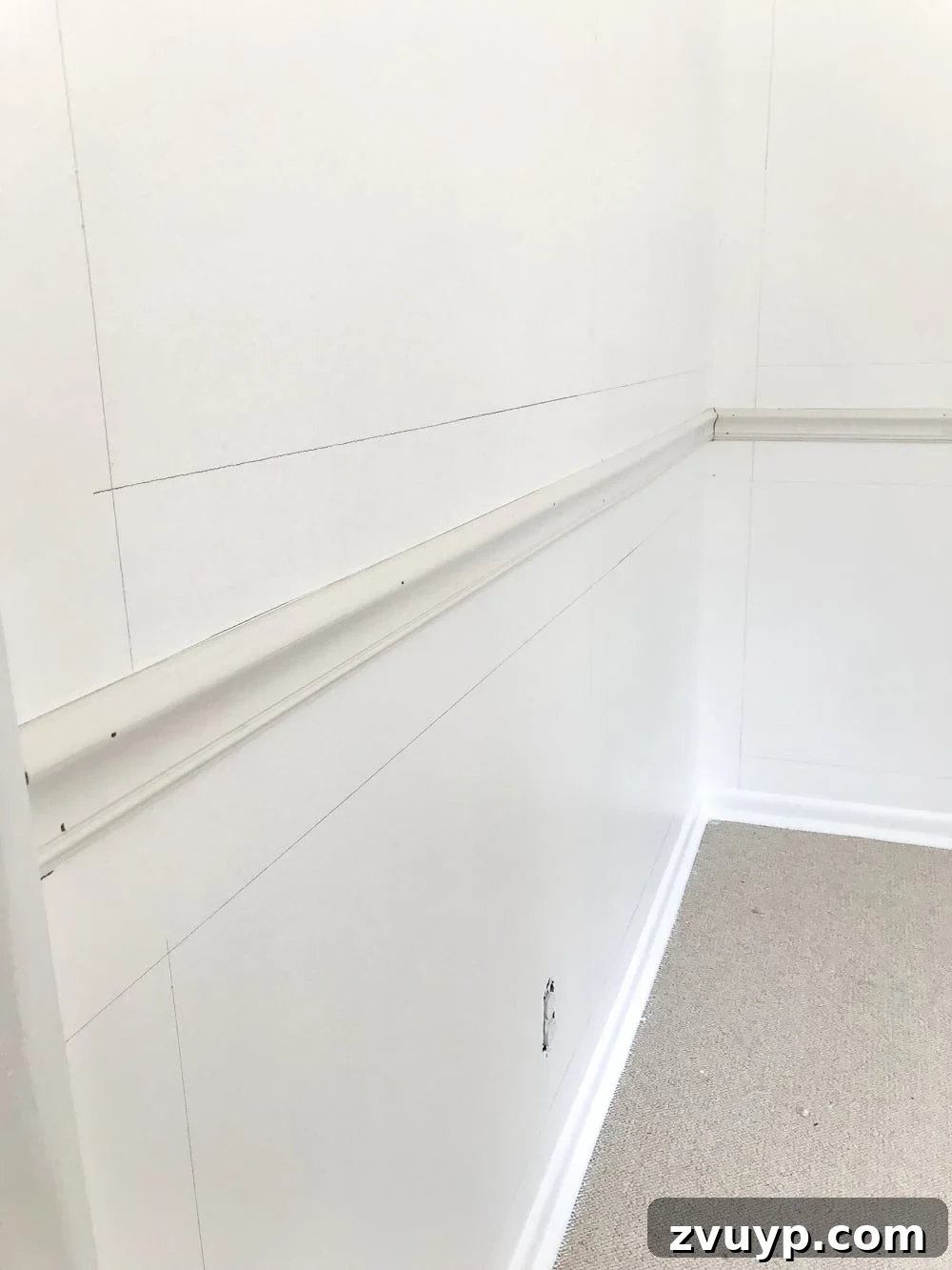 Crafting Your Perfect Picture Frames 5 Securing chair rail molding with a brad nailer and construction adhesive