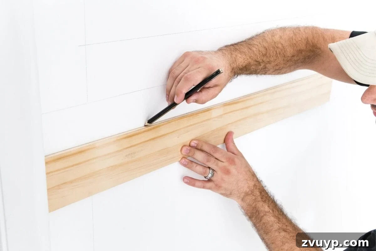Crafting Your Perfect Picture Frames 7 Using a spacer board to mark consistent gaps for picture frame molding