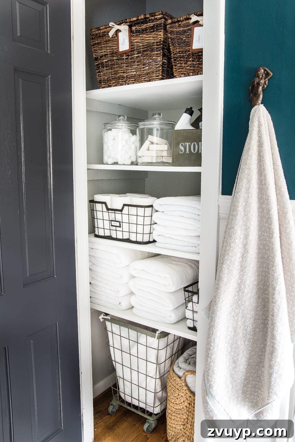 Reclaim Your Space The Ultimate Whole-House Decluttering Guide With a Free Printable 8 Organized linen closet featuring smart storage solutions and a decluttering checklist printable for easy access